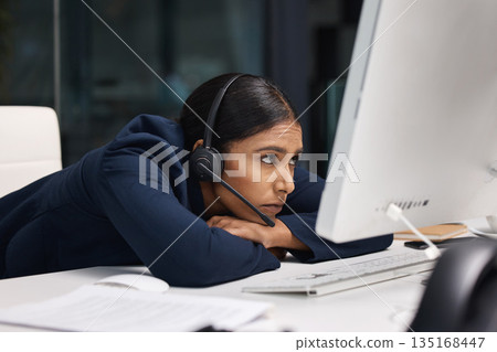 Tired, call center problem and a woman with a computer for online service, support stress and frustrated. Sad, bored and a customer care employee reading an email on a pc at a telemarketing job Tired, call center problem and a woman with a computer for online service, support stress and frustrated. Sad, bored and a customer care employee reading an email on a pc at a telemarketing job 135168447