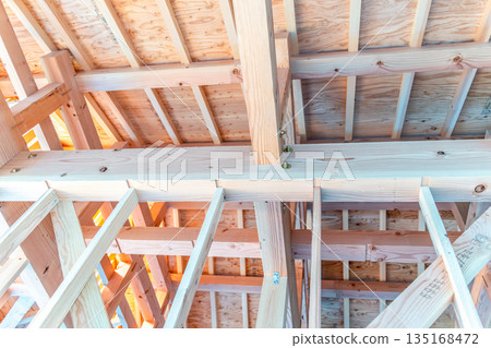 Housing image: The framework supporting the roof of a newly constructed wooden house Housing image: The framework supporting the roof of a newly constructed wooden house 135168472
