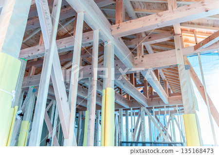 Housing image: The framework supporting the roof of a newly constructed wooden house Housing image: The framework supporting the roof of a newly constructed wooden house 135168473