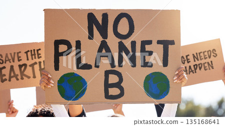 Protest, global warming and poster with a group of people outdoor at a rally or march for conservation. Climate change, freedom and environment with a crowd walking together during a community strike 135168641