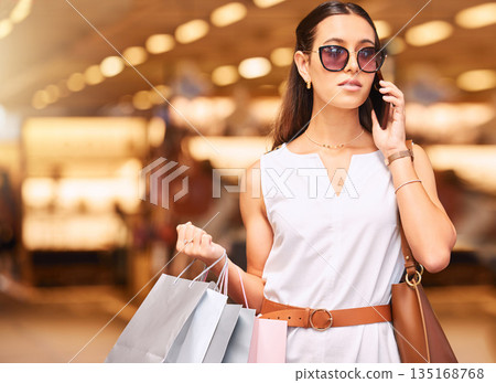 Shopping bag, phone call and woman in mall for fashion, sale or discount deal. Customer person with retail bags, sunglasses and talking on smartphone for communication, store credit or banking mockup Shopping bag, phone call and woman in mall for fashion, sale or discount deal. Customer person with retail bags, sunglasses and talking on smartphone for communication, store credit or banking mockup 135168768