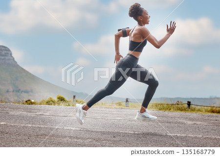 Athlete, wellness and fast woman running and training for outdoor sports, workout and exercise for a marathon. Strong, fitness and healthy female person or runner with speed, sprint and health Athlete, wellness and fast woman running and training for outdoor sports, workout and exercise for a marathon. Strong, fitness and healthy female person or runner with speed, sprint and health 135168779