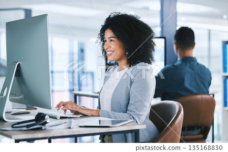 Woman, typing at computer with online tech support and email, consultant at desk with smile at customer service agency. Contact center, communication and happy female agent with feedback and help Woman, typing at computer with online tech support and email, consultant at desk with smile at customer service agency. Contact center, communication and happy female agent with feedback and help 135168830