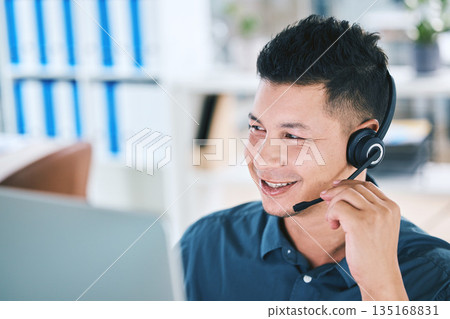 Call center, customer service and a man talking on a microphone for contact us communication. Face of person as crm, telemarketing and sales or technical support agent with a headset and computer Call center, customer service and a man talking on a microphone for contact us communication. Face of person as crm, telemarketing and sales or technical support agent with a headset and computer 135168831