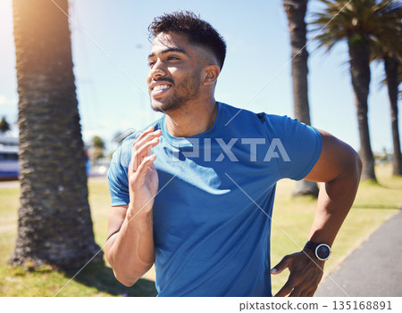Fitness, running and man outdoor at park for exercise, training or cardio health. Happy Indian male athlete or runner in nature for a workout, run or jog while thinking of goals or performance Fitness, running and man outdoor at park for exercise, training or cardio health. Happy Indian male athlete or runner in nature for a workout, run or jog while thinking of goals or performance 135168891