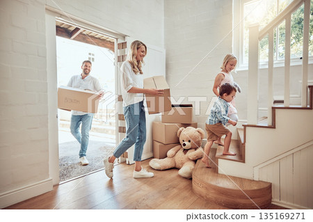 Children, new home or parents moving boxes in real estate property investment or rental apartment. Mother helping, father or happy kids carrying or lifting a box in family house to move in together 135169271