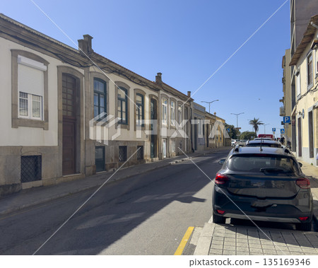 Building with facades in european town. Street view with historic house, cobbled road, old mediaeval Building with facades in european town. Street view with historic house, cobbled road, old mediaeval 135169346