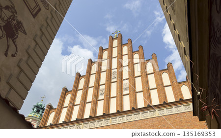 Cathedral basilica church in Warsaw. Gothic catholic landmark with brick tower, cross, facades and Cathedral basilica church in Warsaw. Gothic catholic landmark with brick tower, cross, facades and 135169353