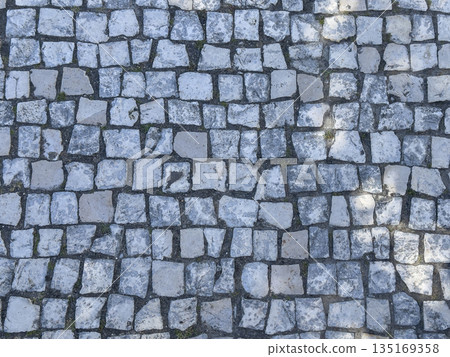 Cobbled stone surface with paving pattern. Textured ground and roadway material creating historic Cobbled stone surface with paving pattern. Textured ground and roadway material creating historic 135169358