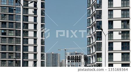 Development in urban city landscape. Modern architecture with tall skyscraper skyline, residential 135169364