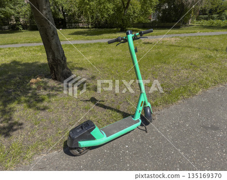Electric scooter in urban city street. Modern eco vehicle with wheel mobility, smart technology for 135169370