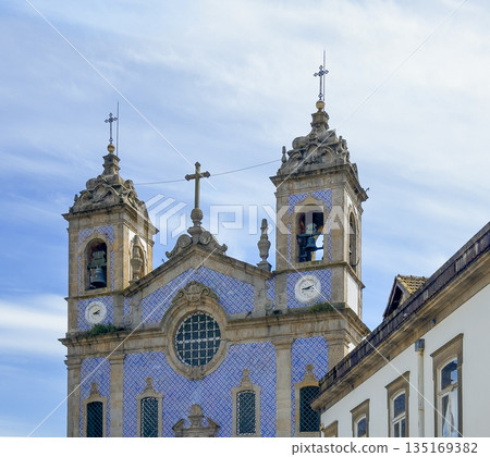 Oporto church of Saint Ildefonso in Portugal. Baroque catholic landmark with blue azulejo tile Oporto church of Saint Ildefonso in Portugal. Baroque catholic landmark with blue azulejo tile 135169382