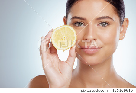 Beauty skincare, face and woman with lemon in studio isolated on a white background. Portrait, natural or female model with fruit for vitamin c, vegan nutrition or healthy diet, wellness or cosmetics Beauty skincare, face and woman with lemon in studio isolated on a white background. Portrait, natural or female model with fruit for vitamin c, vegan nutrition or healthy diet, wellness or cosmetics 135169610