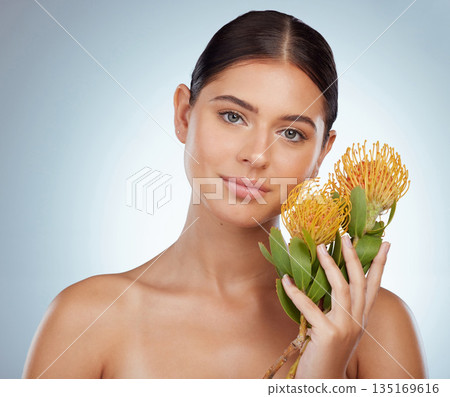 Face, skincare and woman with protea flowers in studio isolated on a white background. Portrait, natural and female model with floral pincushion plants for makeup, cosmetics and beauty skin treatment Face, skincare and woman with protea flowers in studio isolated on a white background. Portrait, natural and female model with floral pincushion plants for makeup, cosmetics and beauty skin treatment 135169616