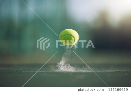 Sports, tennis and a ball bouncing on a court outdoor during a game, competition or training with chalk. Fitness, exercise and club with still life sport equipment outside for a workout or match 135169619