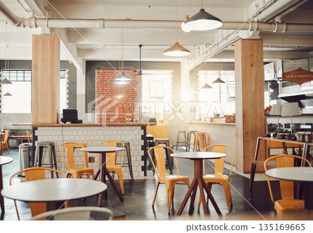 Empty, interior design of modern restaurant and open space with a lens flare during the day. Decoration, lights and luxury furniture for fine dining and set up of cafe or coffee shop in the city Empty, interior design of modern restaurant and open space with a lens flare during the day. Decoration, lights and luxury furniture for fine dining and set up of cafe or coffee shop in the city 135169665