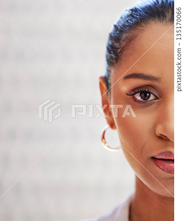 Half, serious portrait and woman face isolated on blurred background, business marketing space and promotion. Serious, empowerment and professional or young african person, worker or employee zoom 135170066