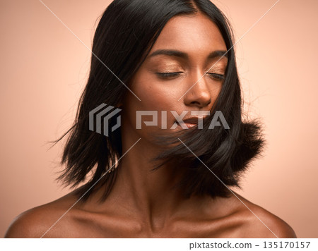 Hair care, shake and woman in studio for beauty, keratin and healthy salon treatment. Wellness, cosmetic and young female model with motion for shiny, clean and soft hairstyle by a background. Hair care, shake and woman in studio for beauty, keratin and healthy salon treatment. Wellness, cosmetic and young female model with motion for shiny, clean and soft hairstyle by a background. 135170157
