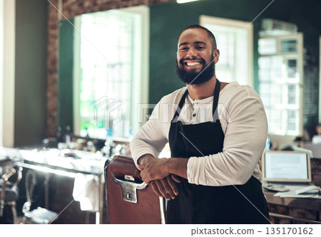 Barber shop employee, hair stylist and black man portrait of an entrepreneur with smile. Salon, professional worker and male person face with happiness and proud from small business and beauty parlor Barber shop employee, hair stylist and black man portrait of an entrepreneur with smile. Salon, professional worker and male person face with happiness and proud from small business and beauty parlor 135170162