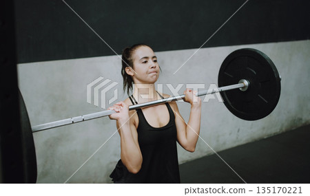Weightlifting, fitness and woman lifting barbell in gym for training, exercise and intense workout. Deadlift, strong muscle and female body builder lift weights for challenge, wellness and strength Weightlifting, fitness and woman lifting barbell in gym for training, exercise and intense workout. Deadlift, strong muscle and female body builder lift weights for challenge, wellness and strength 135170221