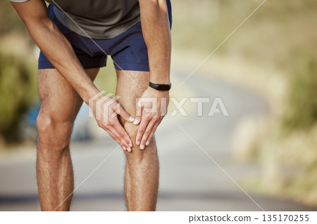 Man, hands and runner with knee pain in fitness, injury or sore inflammation on bone in the outdoors. Hand of male person or athlete holding painful leg area in sport accident or bruise from running Man, hands and runner with knee pain in fitness, injury or sore inflammation on bone in the outdoors. Hand of male person or athlete holding painful leg area in sport accident or bruise from running 135170255