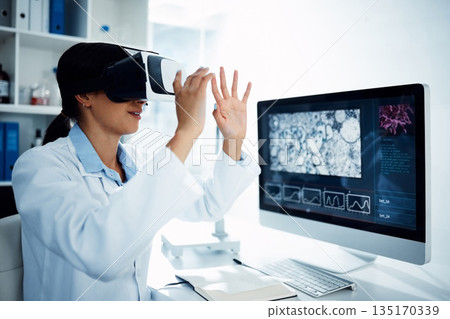 Woman, scientist and VR goggles with computer screen, futuristic tech with metaverse and innovation in laboratory. Virtual reality, digital science data and UX with biotechnology research of bacteria 135170339