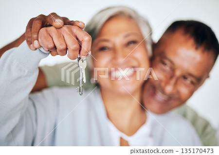 Senior couple, portrait and keys in hand with smile for new home, real estate deal or property for happy retirement. Elderly woman, man and excited face for investment in house, apartment or mortgage Senior couple, portrait and keys in hand with smile for new home, real estate deal or property for happy retirement. Elderly woman, man and excited face for investment in house, apartment or mortgage 135170473