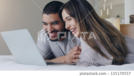 Happy, couple and watching movie on laptop in bedroom for online subscription, media download or relax together. Young man, woman and computer technology for streaming, internet or connection at home Happy, couple and watching movie on laptop in bedroom for online subscription, media download or relax together. Young man, woman and computer technology for streaming, internet or connection at home 135170557