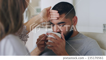 Sick, fever and tea with couple in bedroom for problem, medical and illness recovery. Relax, love and care with man and woman helping in bed at home for virus, fatigue and disease treatment 135170561