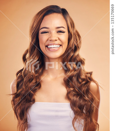 Happy woman in portrait, hair and beauty with balayage, curly hairstyle with haircare, keratin treatment on studio background. Female model smile with color highlights, shine and texture with growth 135170669