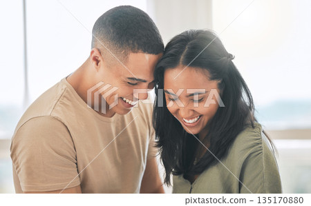 Couple, smile and laughing in home for love, intimacy and relax for romance, bonding and trust together. Young man, woman and happy partner with care, quality time or happiness in loving relationship 135170880