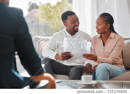 Contract, married couple with financial advisor and documents in a living room of a home. Investment or investment, paperwork and planning with people in a meeting sitting on furniture together Contract, married couple with financial advisor and documents in a living room of a home. Investment or investment, paperwork and planning with people in a meeting sitting on furniture together 135170898