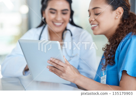 Hospital, doctors and women in discussion on tablet for medical analysis, research and internet. Healthcare, clinic and female health workers talking on digital tech for advice, consulting or service 135170903
