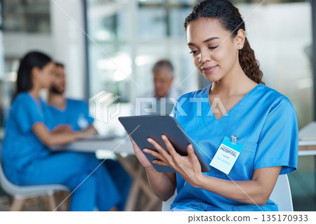 Hospital, doctor and woman on tablet for medical analysis, research and diagnosis report. Healthcare, clinic and happy female nurse on digital tech for wellness app, online consulting and service Hospital, doctor and woman on tablet for medical analysis, research and diagnosis report. Healthcare, clinic and happy female nurse on digital tech for wellness app, online consulting and service 135170933