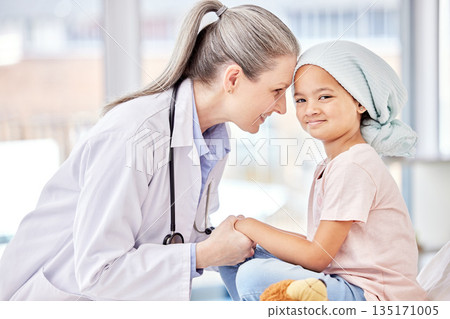 Smile, pediatrician and child holding hands on bed in hospital for children, health and support in cancer treatment. Pediatrics, healthcare and happy kid, doctor with young patient for health care. Smile, pediatrician and child holding hands on bed in hospital for children, health and support in cancer treatment. Pediatrics, healthcare and happy kid, doctor with young patient for health care. 135171005