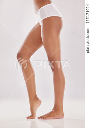 Woman in underwear, legs and beauty with hair removal and natural cosmetics isolated on studio background. Body, skincare and female model, dermatology and self care with epilation and treatment 135171024