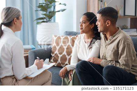 Couple on sofa, therapist and counselling for support, love and help with relationship advice together. Man, woman and psychologist in conversation, healthy communication and healing marriage therapy 135171123