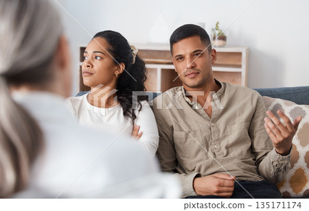 Angry couple on sofa, therapy and marriage counselling, advice and problem solving in relationship. Stress, man and woman with therapist in conversation, work on healthy communication and healing. 135171174