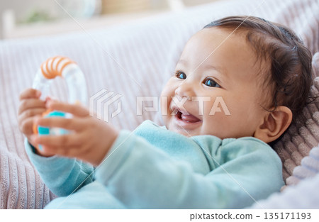 Happy baby, rattle and child in bedroom for childhood development, growth and cute smile at home. Adorable young girl, infant kid and playing with toys for happiness, fun and relax in nursery room Happy baby, rattle and child in bedroom for childhood development, growth and cute smile at home. Adorable young girl, infant kid and playing with toys for happiness, fun and relax in nursery room 135171193