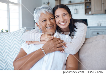 Hug, sofa and portrait of women smile for care, trust and support on a couch in a home together for mothers day. Happiness, love and elderly mother and daughter relax in a living room or lounge 135171207