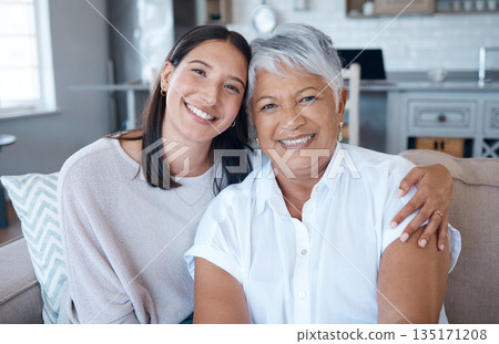 Hug, sofa and portrait of elderly mother and daughter smile for care, trust and support on sofa or couch in a home. Happiness, love and women relax together in a living room or lounge on mothers day Hug, sofa and portrait of elderly mother and daughter smile for care, trust and support on sofa or couch in a home. Happiness, love and women relax together in a living room or lounge on mothers day 135171208