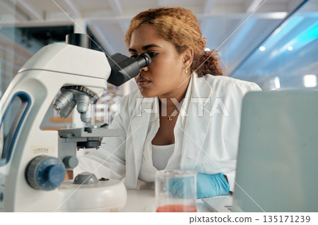 Science, healthcare and microscope with a woman at work in a laboratory for research or innovation. Investigation, medical and development with a female scientist working in a lab for pharmaceuticals Science, healthcare and microscope with a woman at work in a laboratory for research or innovation. Investigation, medical and development with a female scientist working in a lab for pharmaceuticals 135171239