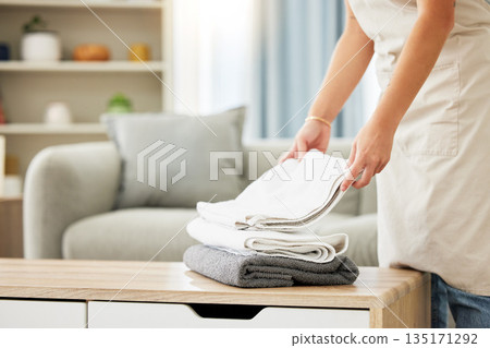 Cleaner, towel and woman hands with a pile of clean laundry, washing linen or hotel room service. Person, maid and routine cleaning of a fresh stack of towels or washed clothing for home bathroom Cleaner, towel and woman hands with a pile of clean laundry, washing linen or hotel room service. Person, maid and routine cleaning of a fresh stack of towels or washed clothing for home bathroom 135171292