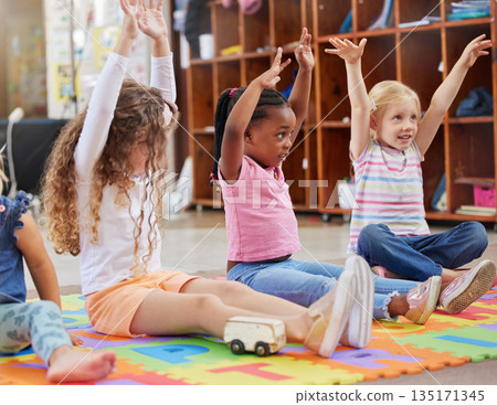 Education, raise hands and children in kindergarten in a classroom for education or knowledge. Daycare, happy and young kid students with a question gesture for learning in lesson together at nursery Education, raise hands and children in kindergarten in a classroom for education or knowledge. Daycare, happy and young kid students with a question gesture for learning in lesson together at nursery 135171345
