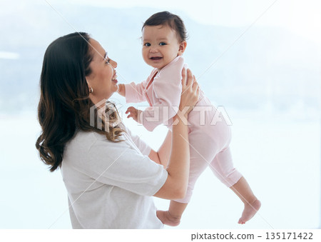 Baby laugh, portrait and mom in a home with newborn, care and parent love together feeling happy. Face, family and young child with mother and happiness in house with mama and childcare in lounge Baby laugh, portrait and mom in a home with newborn, care and parent love together feeling happy. Face, family and young child with mother and happiness in house with mama and childcare in lounge 135171422