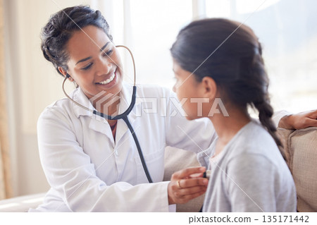 Doctor, cardiology and young child at a hospital and clinic for health consultation with a smile. Healthcare, wellness and pediatrician with kid listening to heart for medical consulting with expert 135171442