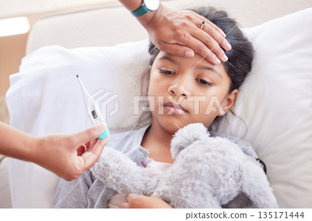 Sick, worry and thermometer with mother and child in bedroom for support, illness and healthcare. Virus, pain and help with hand of woman and young girl in family home for care, love and fever Sick, worry and thermometer with mother and child in bedroom for support, illness and healthcare. Virus, pain and help with hand of woman and young girl in family home for care, love and fever 135171444