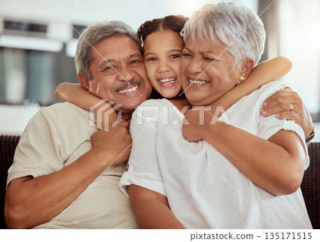 Home, grandparents hug portrait and family with child and happiness on a living room couch. Fun, smile and happy bonding with childcare, love and kid together with a young girl on a house sofa Home, grandparents hug portrait and family with child and happiness on a living room couch. Fun, smile and happy bonding with childcare, love and kid together with a young girl on a house sofa 135171515