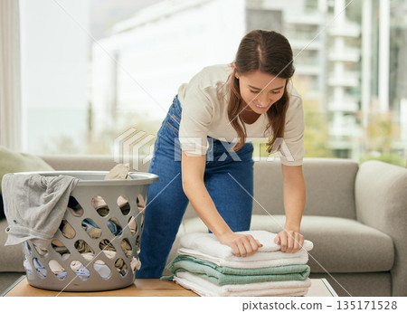 Cleaning, laundry and towels with woman in living room for housekeeping, fabric and chores. Cotton, maintenance and linen with female cleaner at home for washing, hospitality and housekeeper services Cleaning, laundry and towels with woman in living room for housekeeping, fabric and chores. Cotton, maintenance and linen with female cleaner at home for washing, hospitality and housekeeper services 135171528