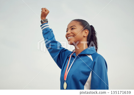 Happy woman, fist and celebration in sports for winning success or victory achievement on mockup. Female person, athlete or winner with smile in joy for win, award or sport medal on mock up space 135171639